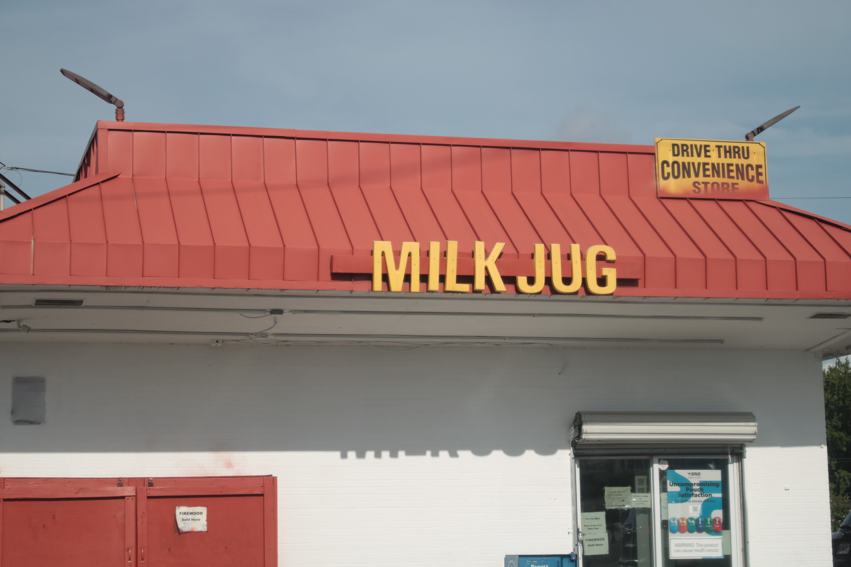 a sign that says MILK JUG